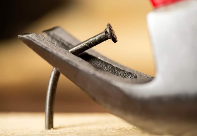 Remove nails from wood with claw hammer